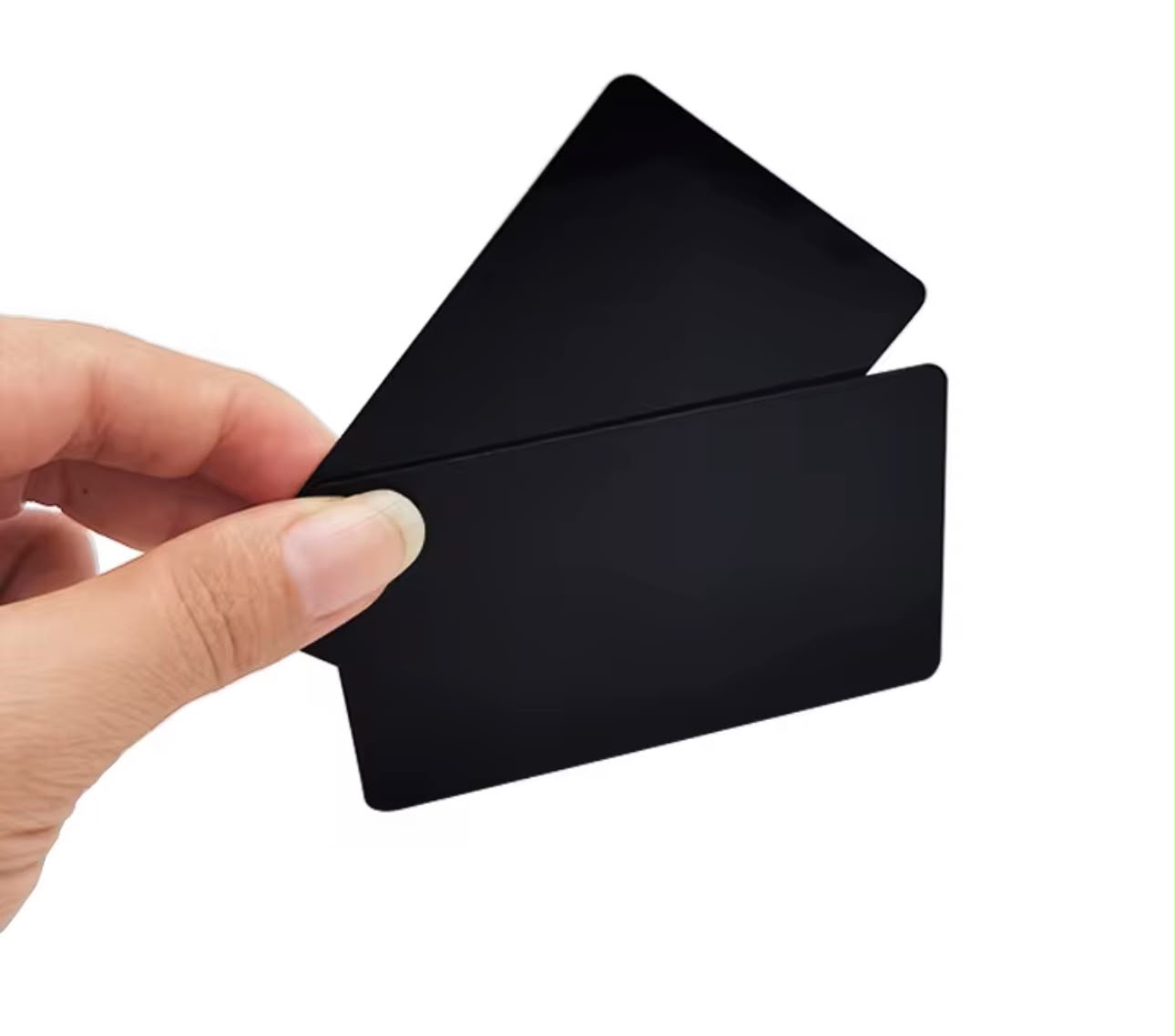 Matte black Cardless NFC business card held in a hand
